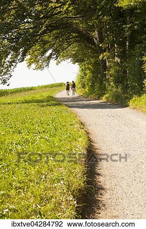 Zwei Frauen laufen auf einem Weg, bei Zurich, Schweiz, Europa View Large Photo Image Stock Image - Zwei Frauen laufen auf einem Weg, bei Zurich, Schweiz, Europa. Fotosearch