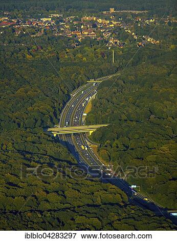 Stock Photo - A3 motorway through forest, near Oberhausen, Ruhr district, North Rhine-Westphalia, Germany, Europe. Fotosearch