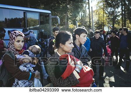Arrival of a bus with refugees, first reception facility on the border with Austria, Wegscheid, Bavaria, Germany, Europe View Large Photo Image Stock Photo - Arrival of a bus with refugees, first reception facility on the border with Austria, Wegscheid, Bavaria, Germany, Europe. Fotosearch