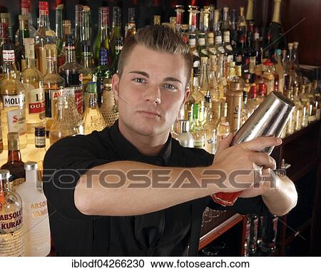 Stock Image - Barman mixing cocktail in a cocktail bar, Jase Livingbar, Dusseldorf, North Rhine-Westphalia, Germany, Europe. Fotosearch