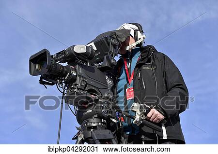 Cameraman filming, Switzerland, Europe View Large Photo Image Stock Image - Cameraman filming, Switzerland, Europe. Fotosearch