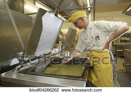 Chef stirring a large cooking vessel, canteen kitchen, Catering, Germany, Europe View Large Photo Image Stock Image - Chef stirring a large cooking vessel, canteen kitchen, Catering, Germany, Europe. Fotosearch
