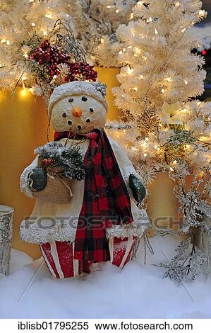 Christmas decorations, snowman in front of a Christmas tree View Large Photo Image Stock Photography - Christmas decorations, snowman in front of a Christmas tree. Fotosearch