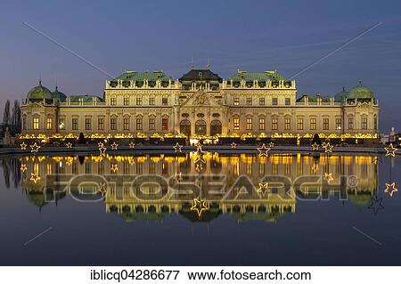 Christmas lights with Christmas Market in front of Belvedere Palace, reflection in the lake, Vienna, Austria, Europe View Large Photo Image Stock Photo - Christmas lights with Christmas Market in front of Belvedere Palace, reflection in the lake, Vienna, Austria, Europe. Fotosearch