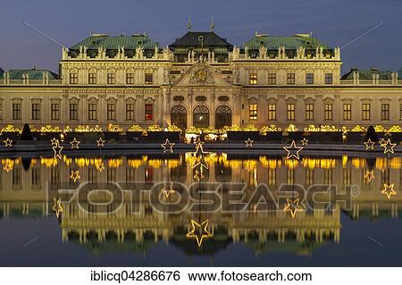 Christmas lights with Christmas Market in front of Belvedere Palace, reflection in the lake, Vienna, Austria, Europe View Large Photo Image Stock Photograph - Christmas lights with Christmas Market in front of Belvedere Palace, reflection in the lake, Vienna, Austria, Europe. Fotosearch