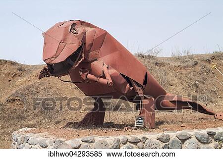 Stock Photography - Dinosaurs statue from metal parts, military scrap military memorial, Mount Bental, Golan Heights, Israel, Asia. Fotosearch