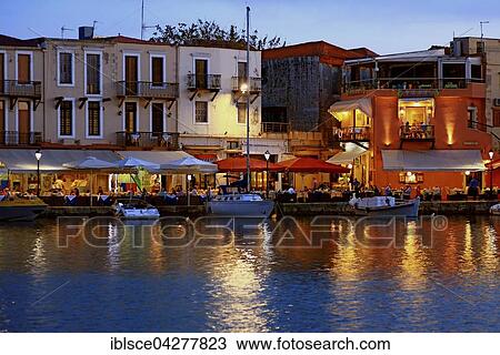 Evening mood, boats and restaurants in Venetian harbour, Rethymno, Crete, Greece, Europe View Large Photo Image Stock Image - Evening mood, boats and restaurants in Venetian harbour, Rethymno, Crete, Greece, Europe. Fotosearch