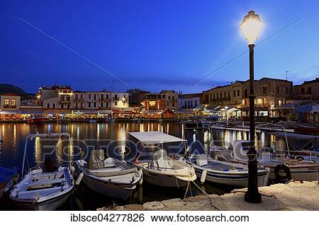 Evening mood, boats and restaurants in Venetian harbour, Rethymno, Crete, Greece, Europe View Large Photo Image Stock Photograph - Evening mood, boats and restaurants in Venetian harbour, Rethymno, Crete, Greece, Europe. Fotosearch