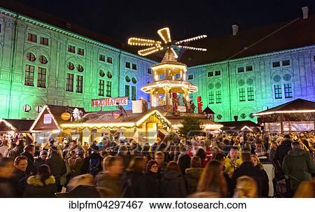 German Christmas market stalls, Christmas pyramid, illuminated buildings, Munich, Upper Bavaria, Germany, Europe View Large Photo Image Stock Photo - German Christmas market stalls, Christmas pyramid, illuminated buildings, Munich, Upper Bavaria, Germany, Europe. Fotosearch
