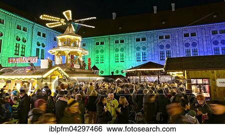 Stock Photograph - German Christmas market stalls, Christmas pyramid, illuminated buildings, Munich, Upper Bavaria, Germany, Europe. Fotosearch