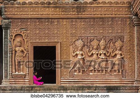 Girl sitting in entrance way, Prasat Phnom Reap south facade, temple at Sangkat Ponhea Pon, Ponhea Lueu District, Phnom Penh, Cambodia, Asia View Large Photo Image Stock Photography - Girl sitting in entrance way, Prasat Phnom Reap south facade, temple at Sangkat Ponhea Pon, Ponhea Lueu District, Phnom Penh, Cambodia, Asia. Fotosearch