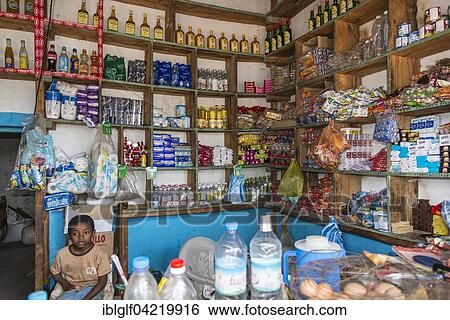 Stock Photograph - Grocery shop with boy, Ilakaka, Madagascar, Africa. Fotosearch