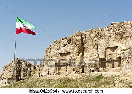 Iranian national flag, two Achaemenid tombs, the graves of Darius II and Artaxerxes I, Naqsh-e Rostam, at Persepolis, Fars Province, Iran, Asia View Large Photo Image Stock Photo - Iranian national flag, two Achaemenid tombs, the graves of Darius II and Artaxerxes I, Naqsh-e Rostam, at Persepolis, Fars Province, Iran, Asia. Fotosearch
