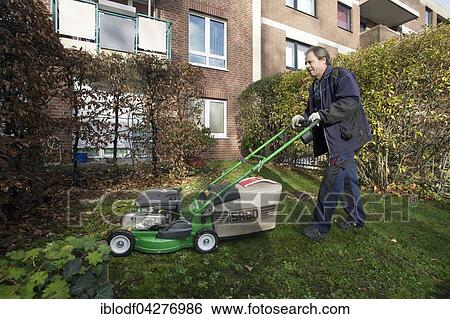 Janitor with mowing lawn lawnmower, Janitorial Service, Germany, Europe View Large Photo Image Stock Photograph - Janitor with mowing lawn lawnmower, Janitorial Service, Germany, Europe. Fotosearch