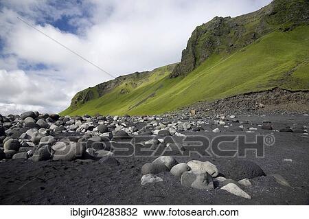 Stock Image - Lava beach with sand and stones, Cape Dyrholaey, Suourland, Iceland, Europe. Fotosearch