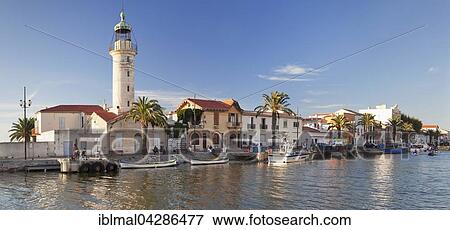 Lighthouse at the port, Petit Camargue, Le-Grau-du-Roi, Department Gard, Languedoc-Roussillon, France, Europe View Large Photo Image Stock Photo - Lighthouse at the port, Petit Camargue, Le-Grau-du-Roi, Department Gard, Languedoc-Roussillon, France, Europe. Fotosearch