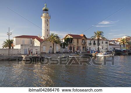 Lighthouse at the port, Petit Camargue, Le-Grau-du-Roi, Department Gard, Languedoc-Roussillon, France, Europe View Large Photo Image Stock Photograph - Lighthouse at the port, Petit Camargue, Le-Grau-du-Roi, Department Gard, Languedoc-Roussillon, France, Europe. Fotosearch