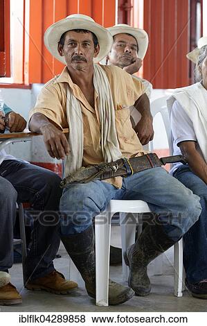 Man with traditional hat and machete, village meeting, Verera de Boqueron, San Francisco, Antioquia Department, Colombia, South America View Large Photo Image Stock Photo - Man with traditional hat and machete, village meeting, Verera de Boqueron, San Francisco, Antioquia Department, Colombia, South America. Fotosearch
