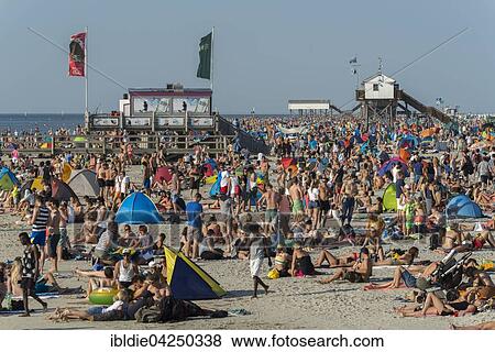 Stock Photo - Many bathers on the beach, crowded beach, Sankt Peter-Ording, North Frisia, Schleswig-Holstein, Germany, Europe. Fotosearch