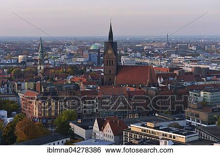 Stock Photograph - Market Church in the historic centre from the Town Hall tower in the evening, Hanover-Mitte, Hanover, Lower Saxony, Germany, Europe. Fotosearch