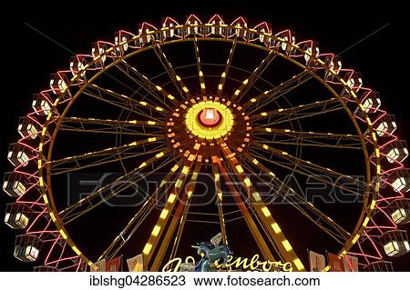 Stock Image - Night scene, Ferris wheel on the Hamburger Dom, Winterdom 2015, St. Pauli, Hamburg, Germany, Europe. Fotosearch