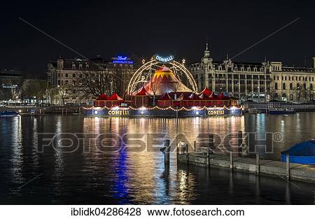 Night scene, view from the Quai Bridge on the River Limmat with the Bauschanzli, Christmas circus Conelli, Zurich, Zurich, Switzerland, Europe View Large Photo Image Stock Photo - Night scene, view from the Quai Bridge on the River Limmat with the Bauschanzli, Christmas circus Conelli, Zurich, Zurich, Switzerland, Europe. Fotosearch