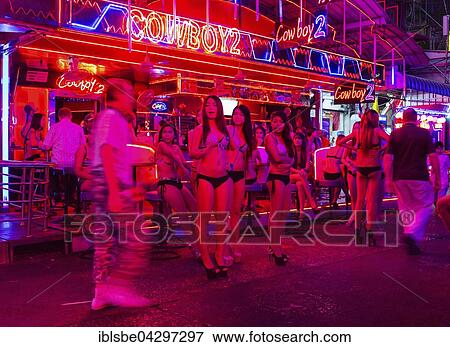 Nightlife, Soi Cowboy Red Light District, girls standing outside bar, Asoke Road, Sukhumvit, Bangkok, Thailand, Asia View Large Photo Image Stock Photo - Nightlife, Soi Cowboy Red Light District, girls standing outside bar, Asoke Road, Sukhumvit, Bangkok, Thailand, Asia. Fotosearch