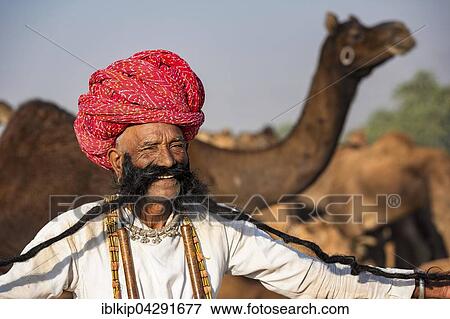 Portrait of an elderly Rajasthani man with a long beard wearing a turban, Pushkar Camel Fair, Pushkar, Rajasthan, India, Asia View Large Photo Image Stock Photo - Portrait of an elderly Rajasthani man with a long beard wearing a turban, Pushkar Camel Fair, Pushkar, Rajasthan, India, Asia. Fotosearch