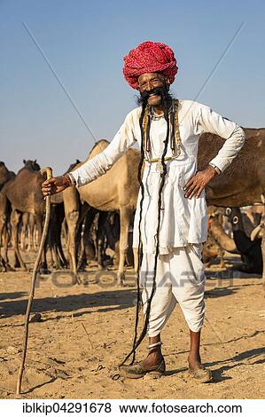 Stock Photo - Portrait of an elderly Rajasthani man with a long beard wearing a turban, Pushkar Camel Fair, Pushkar, Rajasthan, India, Asia. Fotosearch