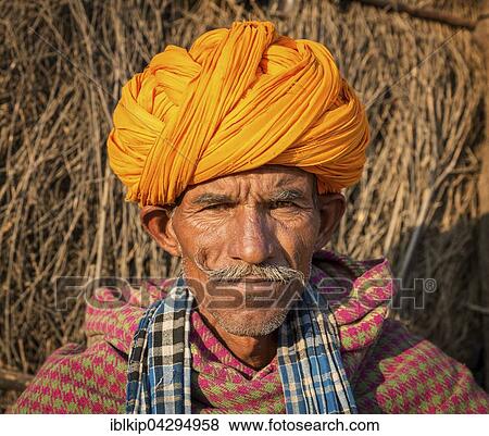 Portrait of Rajasthani man with a yellow turban, Pushkar, Rajasthan, India, Asia View Large Photo Image Stock Photo - Portrait of Rajasthani man with a yellow turban, Pushkar, Rajasthan, India, Asia. Fotosearch