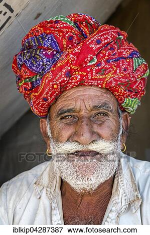 Stock Photo - Rajasthani wearing traditional dress and turban at the Pushkar Mela camel fair, Pushkar, Rajasthan, India, Asia. Fotosearch