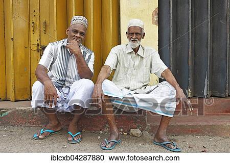 Stock Image - Religious Muslims with caps and white beards, Pettah, Colombo, Sri Lanka, Asia. Fotosearch