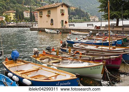 Rowing boats in harbour, Torbole, Lake Garda, Italy, Europe View Large Photo Image Stock Image - Rowing boats in harbour, Torbole, Lake Garda, Italy, Europe. Fotosearch