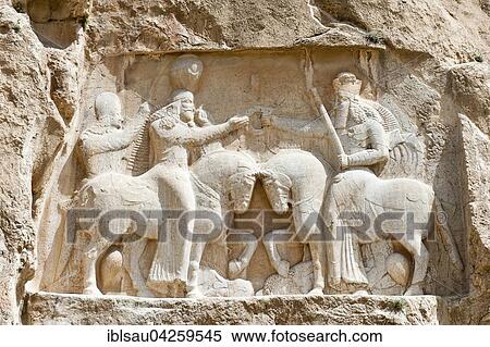 Sassanid rock relief, Ardeshir I receiving the ring of power from God Ahura Mazda, Naqsh-e Rostam, at Persepolis, Fars Province, Iran, Asia View Large Photo Image Stock Photography - Sassanid rock relief, Ardeshir I receiving the ring of power from God Ahura Mazda, Naqsh-e Rostam, at Persepolis, Fars Province, Iran, Asia. Fotosearch