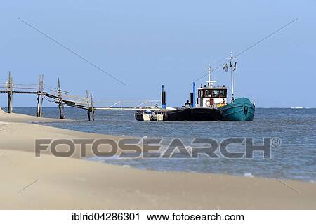 Ship at the ferry dock, Texel, West Frisian Islands, Province of North Holland, The Netherlands, Europe View Large Photo Image Stock Image - Ship at the ferry dock, Texel, West Frisian Islands, Province of North Holland, The Netherlands, Europe. Fotosearch