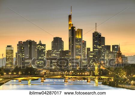 Stock Photo - Skyline, Financial District at dusk, TaunusTurm, Tower 185, Commerzbank, Messeturm, Helaba Landesbank Hessen, German Bank, Frankfurt, Flosserbrucke, Frankfurt am Main, Hesse, Germany, Europe. Fotosearch