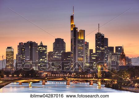 Stock Photograph - Skyline, Financial District at dusk, TaunusTurm, Tower 185, Commerzbank, Messeturm, Helaba Landesbank Hessen, German Bank, Frankfurt, Flosserbrucke, Frankfurt am Main, Hesse, Germany, Europe. Fotosearch
