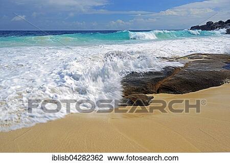 Stock Image - Spray and surf, Anse Intendance, Mahe Island, Seychelles, Africa. Fotosearch