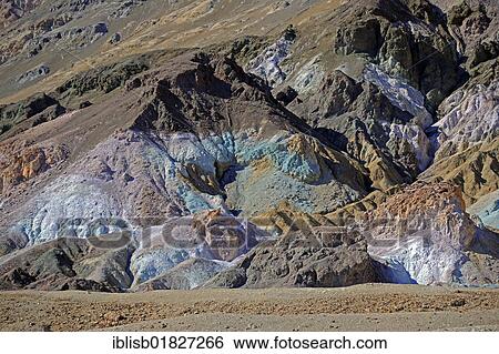 Stones coloured by minerals at the Artists Palette in the evening light, Death Valley National Park, California, USA View Large Photo Image Stock Photograph - Stones coloured by minerals at the Artists Palette in the evening light, Death Valley National Park, California, USA. Fotosearch