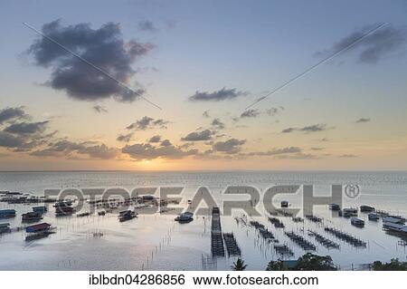 Stock Photograph - Sunset over Songkhla Lake, Thale Sap Songkhla, Thailand, Asia. Fotosearch