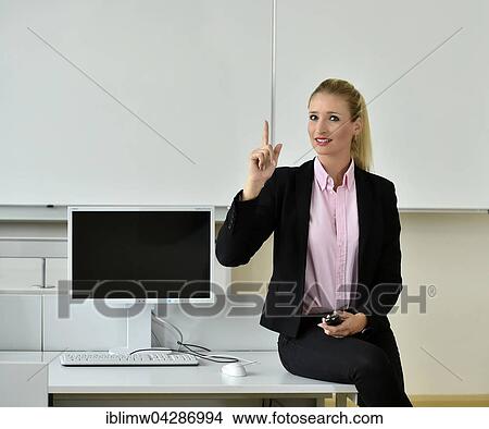 Teacher, tutor, trainer, finger-wagging, IT room, white-board View Large Photo Image Picture - Teacher, tutor, trainer, finger-wagging, IT room, white-board. Fotosearch