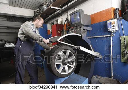 Tire repair shop, auto mechanics, control and change of summer and winter tires on a car, Dusseldorf, North Rhine-Westphalia, Germany, Europe View Large Photo Image Stock Image - Tire repair shop, auto mechanics, control and change of summer and winter tires on a car, Dusseldorf, North Rhine-Westphalia, Germany, Europe. Fotosearch