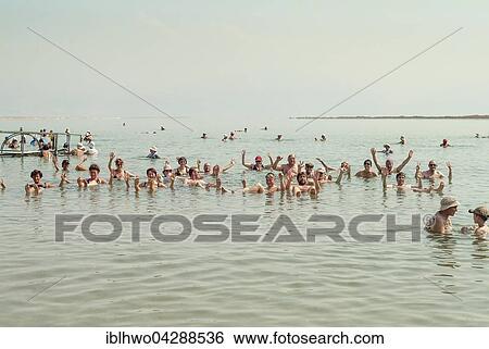 Tourists bathing in the Dead Sea, spa town of Ein Bokek, Israel, Asia View Large Photo Image Stock Photograph - Tourists bathing in the Dead Sea, spa town of Ein Bokek, Israel, Asia. Fotosearch