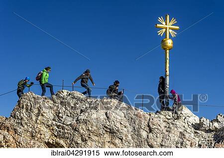 Tourists, summit cross on the Zugspitze, Garmisch-Partenkirchen District, Wetterstein, Alps, Upper Bavaria, Bavaria, Germany, Europe View Large Photo Image Stock Photography - Tourists, summit cross on the Zugspitze, Garmisch-Partenkirchen District, Wetterstein, Alps, Upper Bavaria, Bavaria, Germany, Europe. Fotosearch
