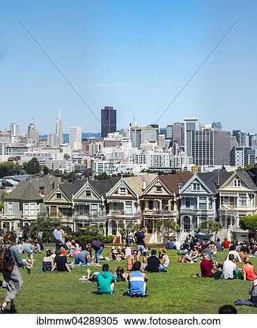 Stock Photography - Tourists, Victorian row of houses, Painted Ladies, Postcard Row, Alamo Square, Steiner Street, San Francisco, California, USA, North America. Fotosearch