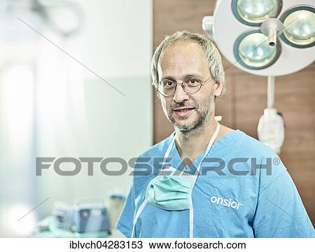 Vet, doctor in operating theatre with face mask around neck, Austria, Europe View Large Photo Image Stock Image - Vet, doctor in operating theatre with face mask around neck, Austria, Europe. Fotosearch