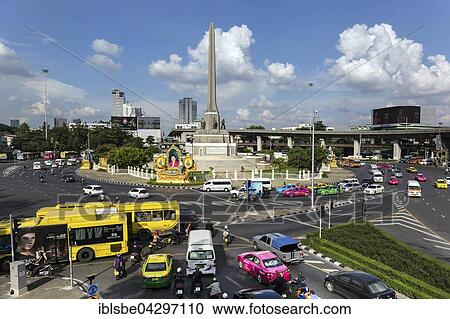 Victory monument, triumphal column at roundabout, city buses, Ratchathewi District, Bangkok, Thailand, Asia View Large Photo Image Stock Image - Victory monument, triumphal column at roundabout, city buses, Ratchathewi District, Bangkok, Thailand, Asia. Fotosearch