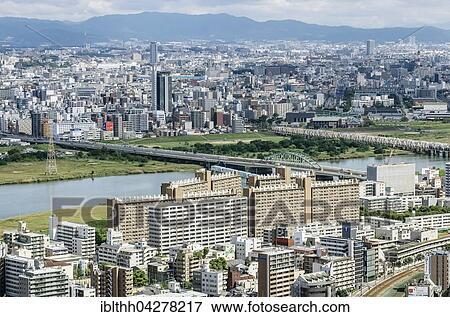 Stock Photo - View of offices and residential buildings from Kita-ku, Osaka, Japan, Asia. Fotosearch