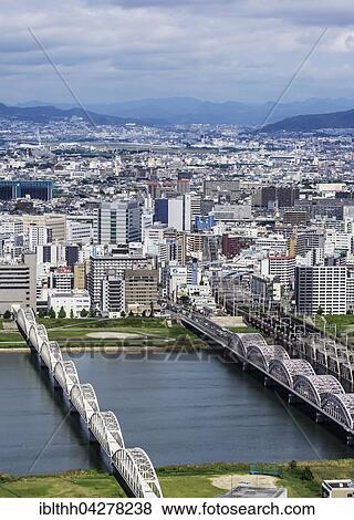 Stock Photo - View of offices and residential buildings from Kita-ku, Osaka, Japan, Asia. Fotosearch