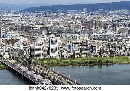 Stock Photography - View of offices and residential buildings from Kita-ku, Osaka, Japan, Asia. Fotosearch